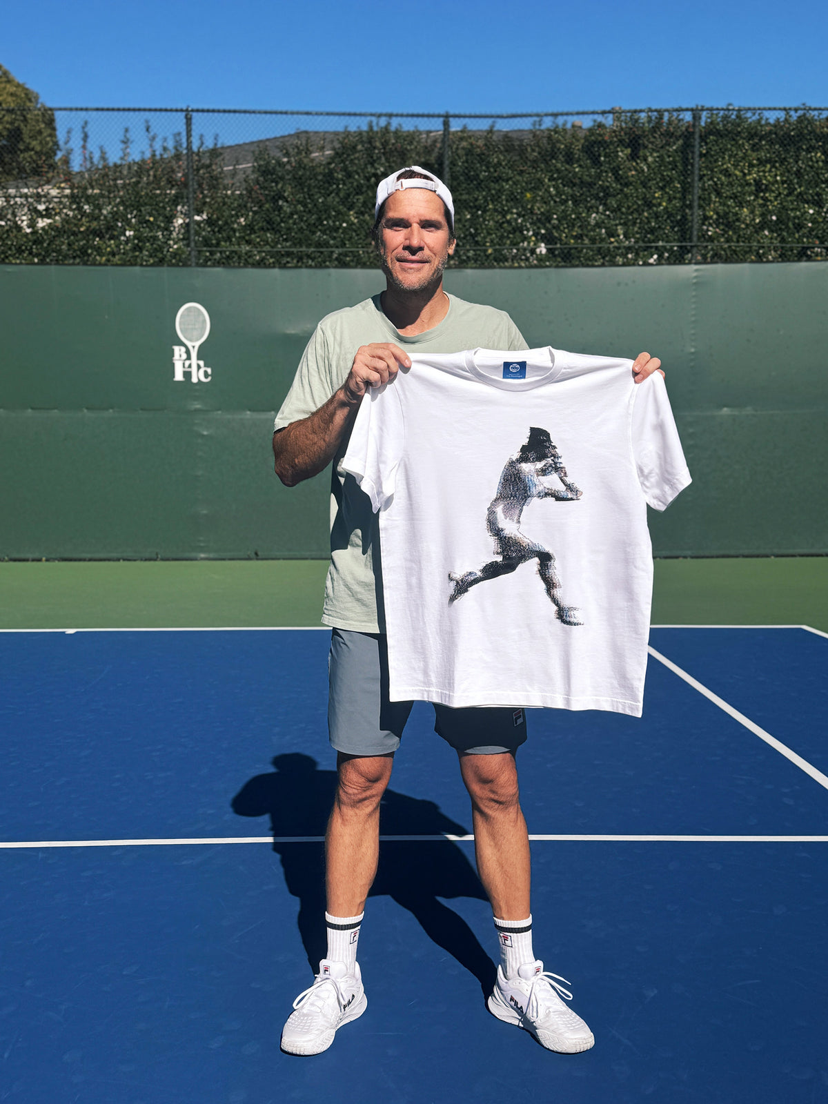 Tommy Haas holding The Monologue edition
